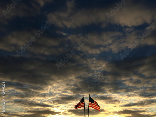 american flags with cloudy sunset sky © carmelod