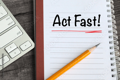 Obraz na plátně concept of act fast, with desk background