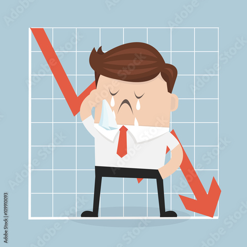 Sad businessman with graph indicating a regression.