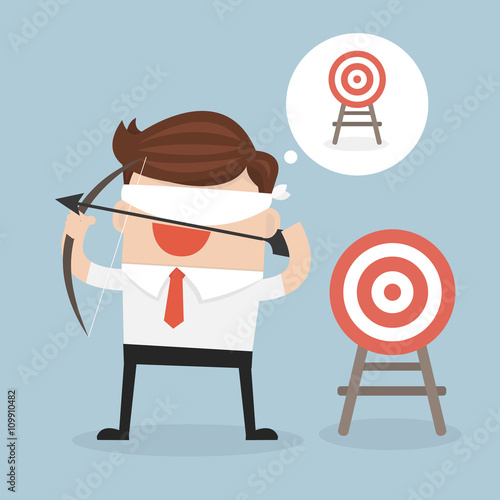 Blindfold businessman holding bow and arrow look for target in w