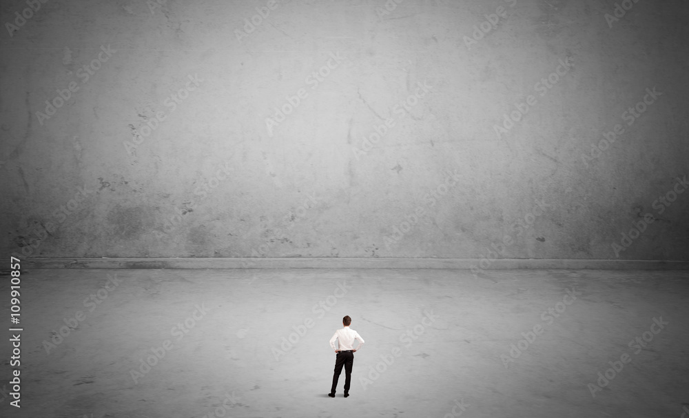 Small business person in large empty space Small business person in large empty space