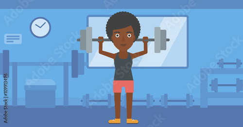 Woman lifting barbell.