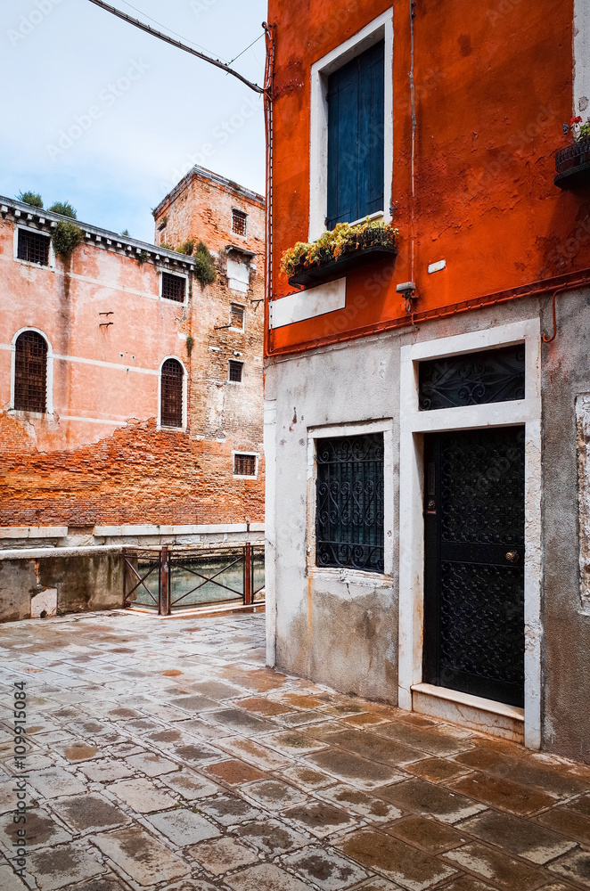Fototapeta premium Traditional street view of old buildings in Venice, ITALY