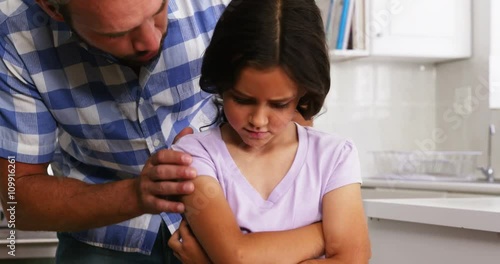 Daughter sulking to her father 