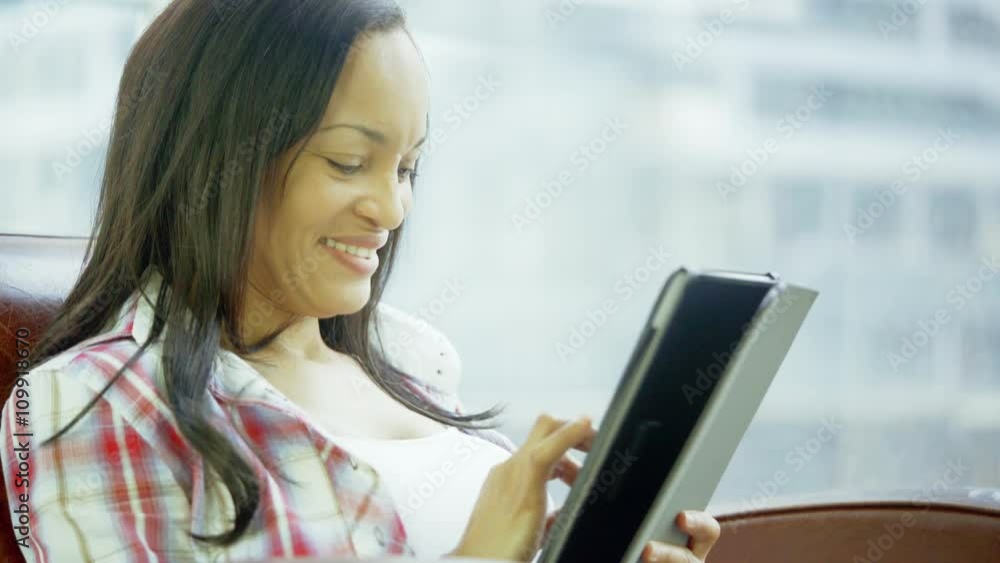 hispanic woman in urban condo sitting in sofa shot 4K hispanic woman in urban condo sitting in sofa shot 4K
