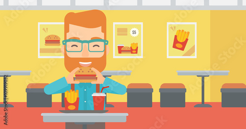 Man eating hamburger. 