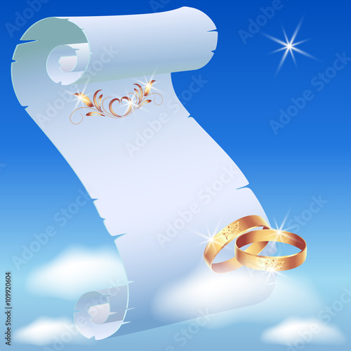 Card with wedding rings in heaven and parchment scroll photo