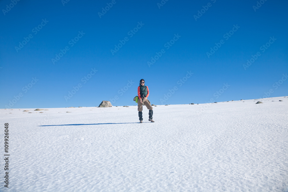 hiker woman standing in snow