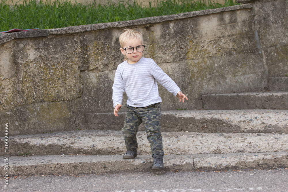 Happy kid with glasses outdoors Happy kid with glasses outdoors