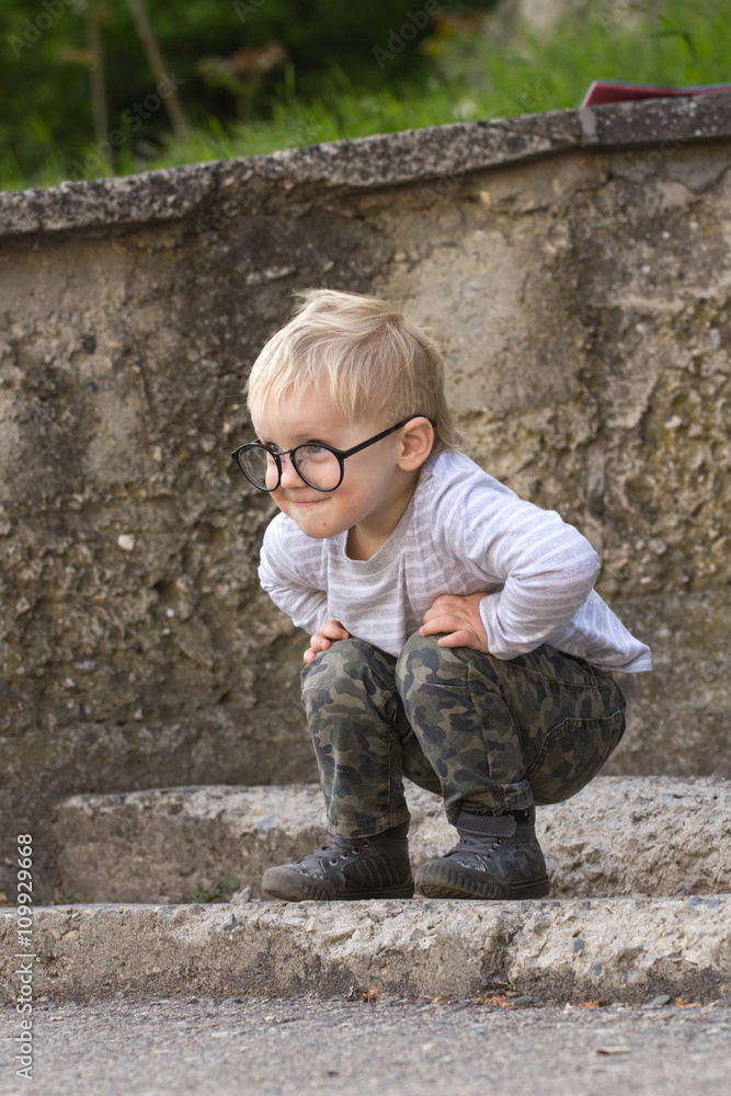 Happy kid with glasses outdoors Happy kid with glasses outdoors