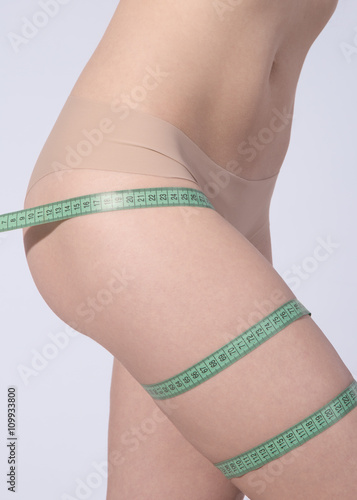 Woman measuring perfect shape of beautiful hips. Healthy lifesty