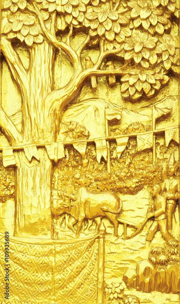 Traditional Thai style art carving of agriculture story on templ