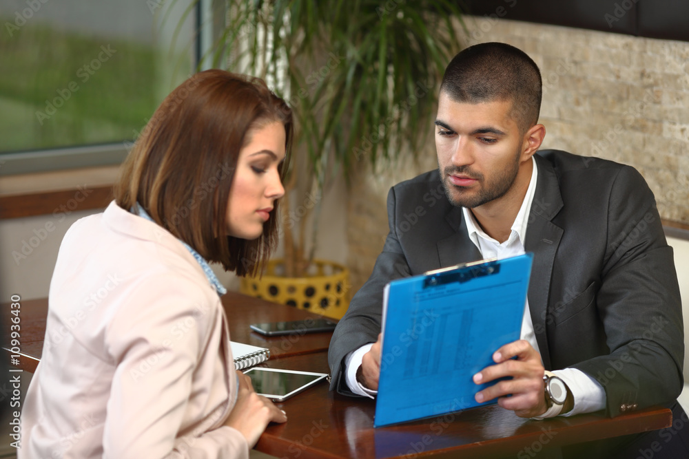 Casual business meeting of man and woman in caffee Casual business meeting of man and woman in caffee