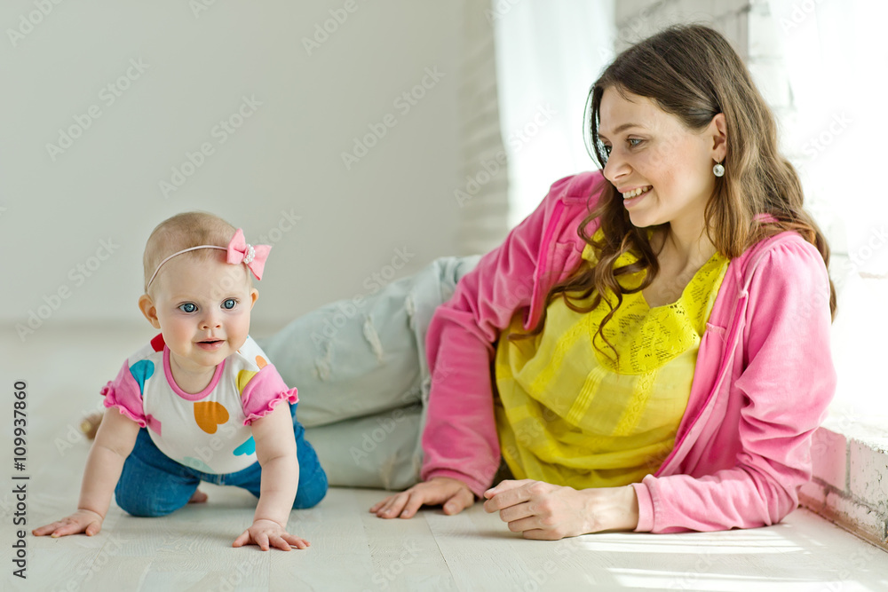 Mother play with baby in studio Mother play with baby in studio