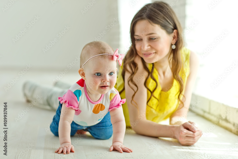 Mother play with baby in studio Mother play with baby in studio