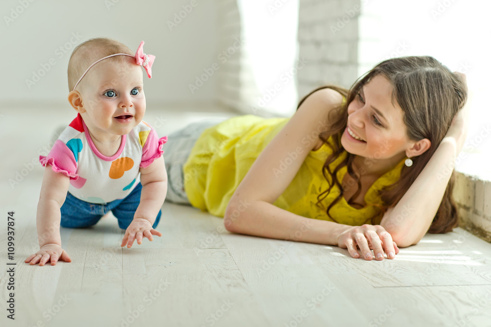Mother play with baby in studio Mother play with baby in studio