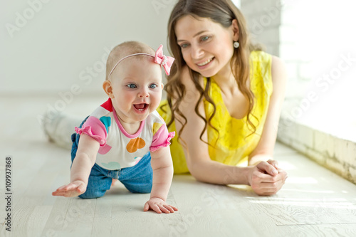Mother play with baby in studio 
