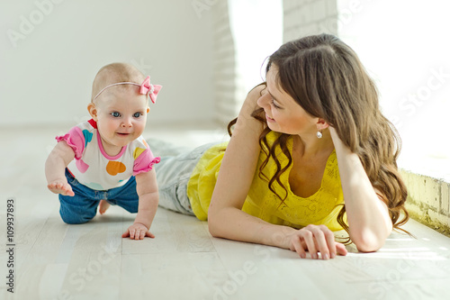 Mother play with baby in studio 