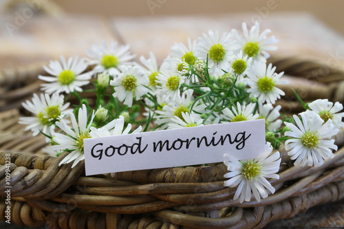 Good morning card with chamomile flowers in wicker basket
