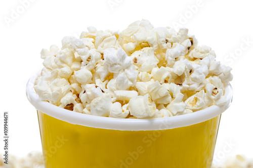 yellow tumbler full of popcorn