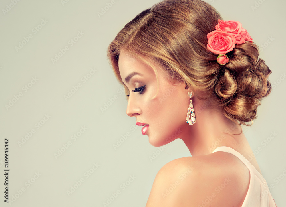 Beautiful model with elegant hairstyle . Beautiful woman with fashion  wedding hairstyle with flower roses and colourful makeup Stock Photo |  Adobe Stock