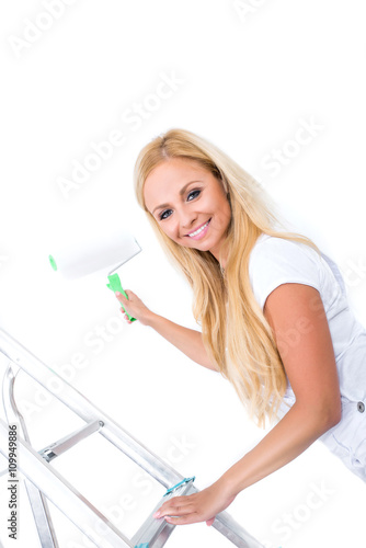 A beautiful young woman painting