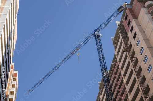 Construction crane between two houses