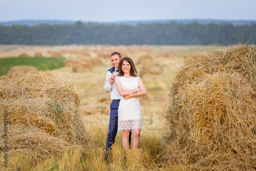 couple walking on field. couple walking on field.