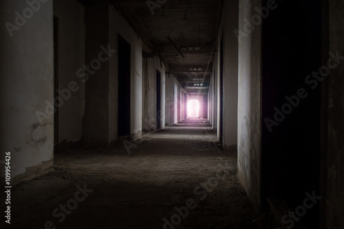 Abandoned building / View of inside the abandoned building, Halloween background. Dark tone with violet light.
