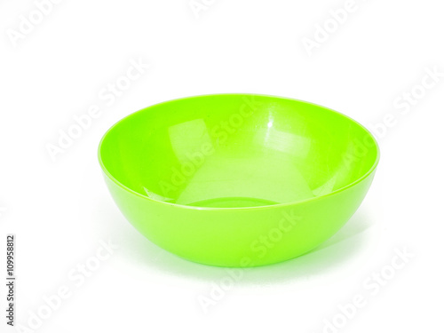 Empty green plastic bowl isolated on white