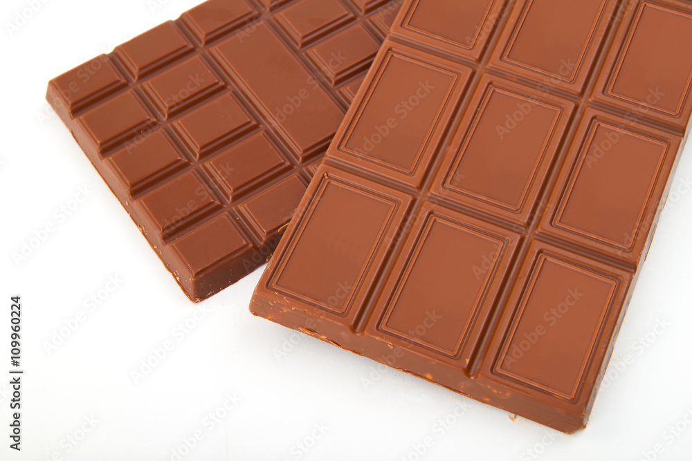 different sorts of chocolate in a stack on white background different sorts of chocolate in a stack on white background