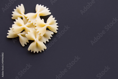 pasta bows on a black background photo