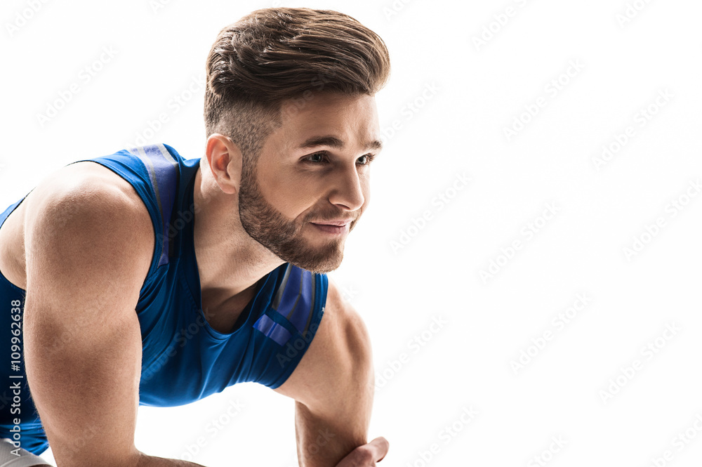 Attractive male jogger is waiting for start