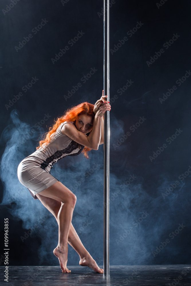 Sport. Pole dancer, woman dancing on pylon