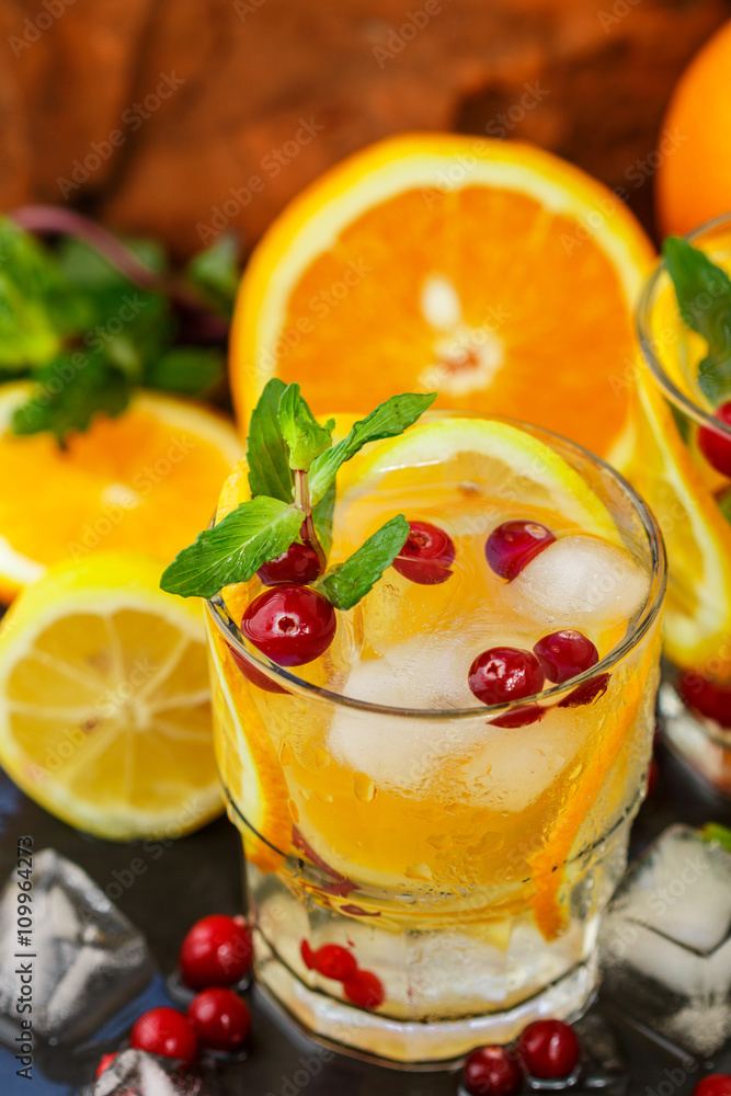 Lemonade - a refreshing drink made of citrus and berries with mint and ice. Selective focus
Lemonade - a refreshing drink made of citrus and berries with mint and ice. Selective focus