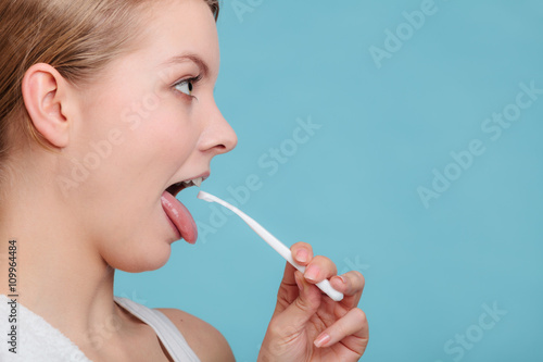 Canvas Print Girl with tongue cleaner.