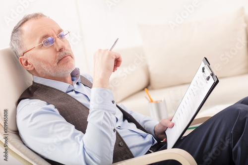 Mature psychotherapist is making serious decision