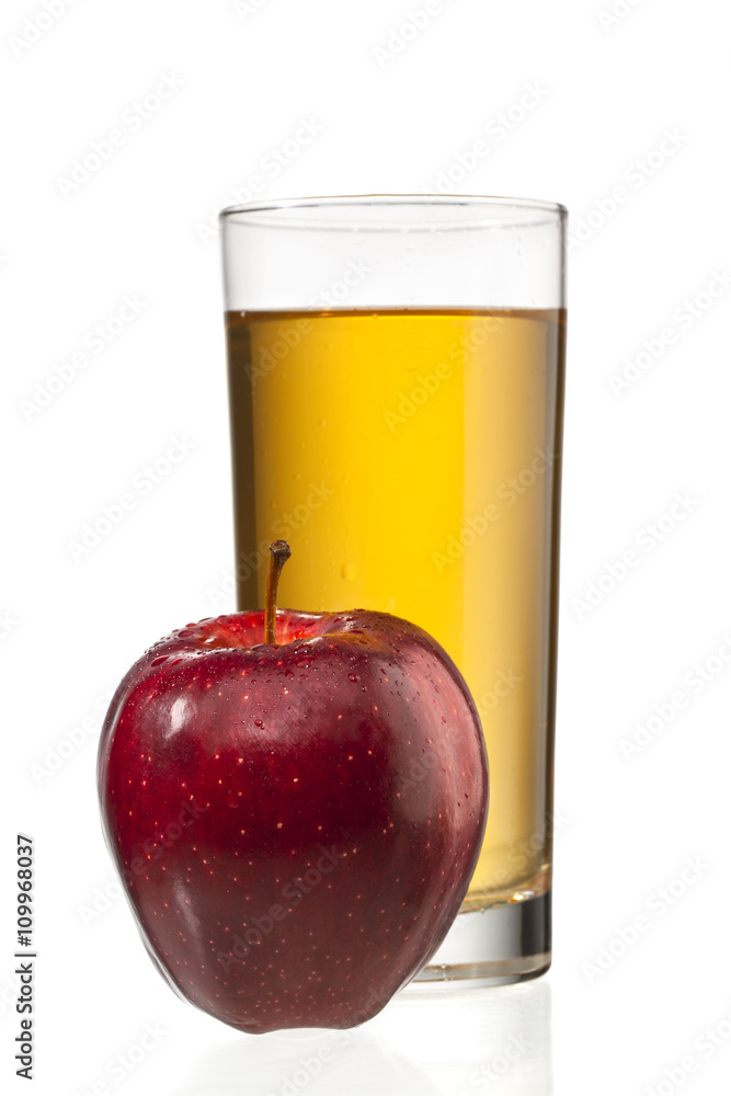 apple beside apple juice glass. apple beside apple juice glass.