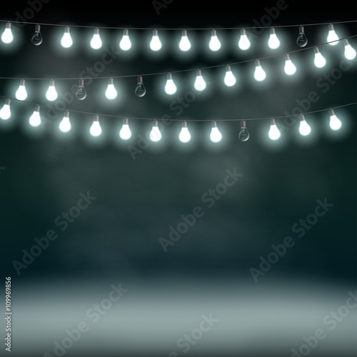 Garlands with bulbs on a dark background. Glowing lights.