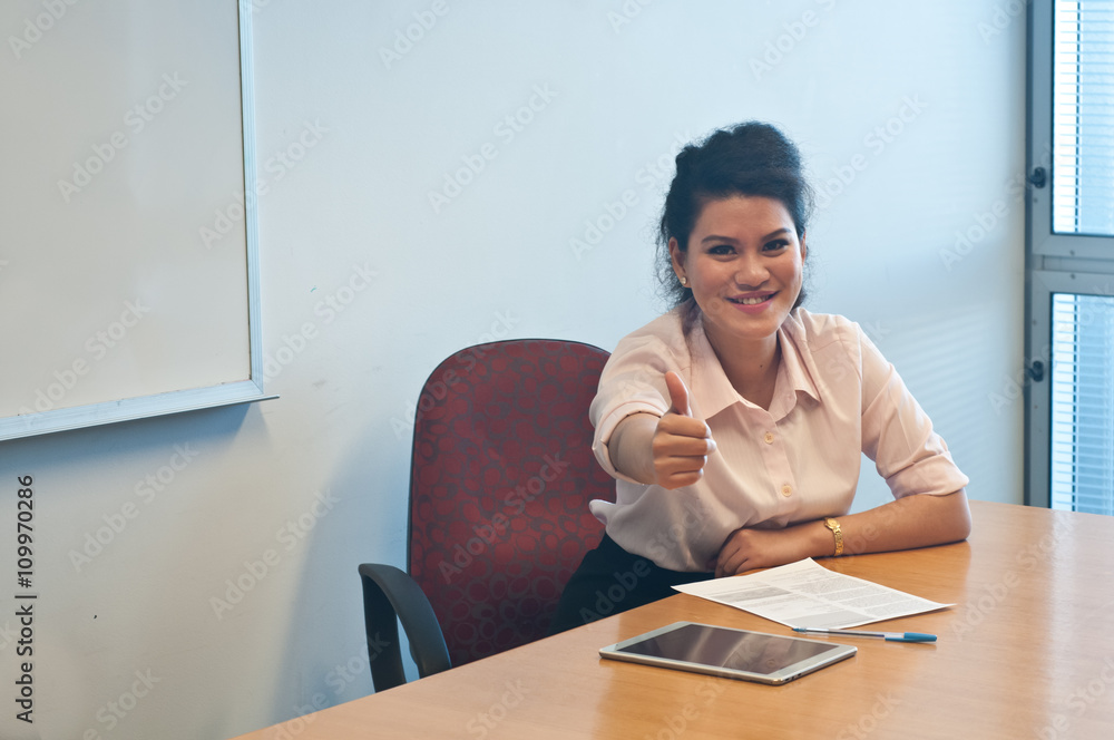 Business woman giving thump up and happy Business woman giving thump up and happy