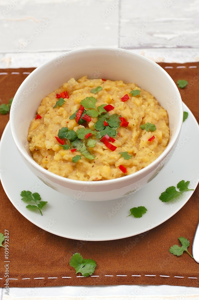 Pease pudding with coriander and chilli in the bowl