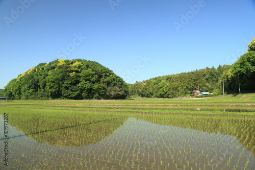 The landscape of Satoyama.The country with hills and fields, a field and a rice paddy is called Satoyama in Japan. This picture was taken in Inzai city in Chiba prefecture.