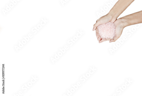 Colored plastic beads on hands photo