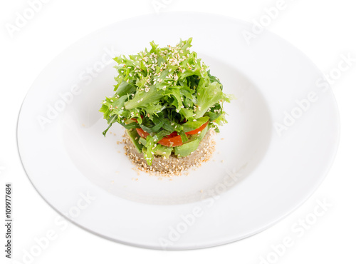  Quinoa salad with avocado and cherry tomatoes.