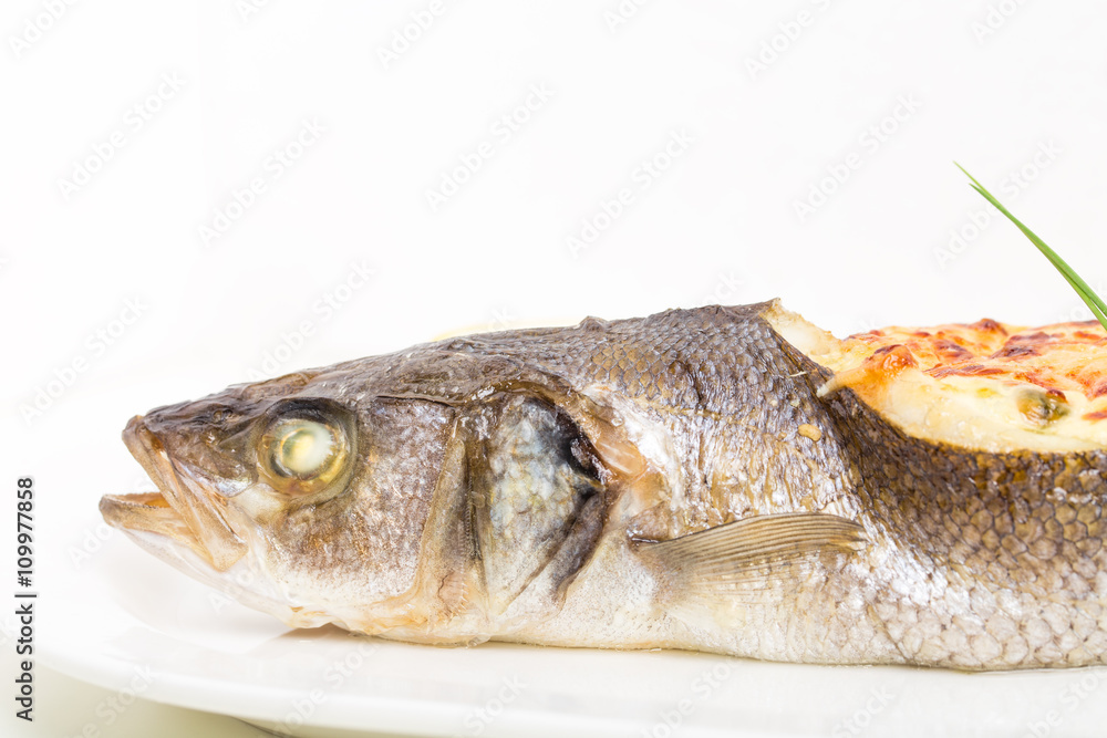 Baked sea bass with seafood and cheese. Baked sea bass with seafood and cheese.