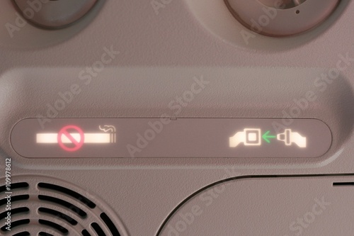 Quadro em tela No smoking and seatbelt fasten sign on the airplane