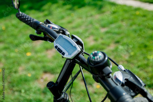 Bike computer on handlebar. Bicycle speed and distance digital measurement tool....