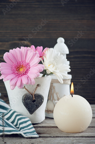 Spring flowers in vase on wooden table