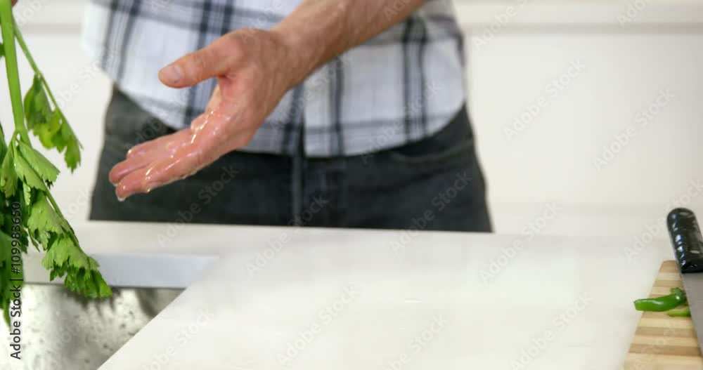 Man washing vegetables Man washing vegetables