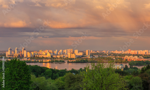 View of Kiev city from Botanic Garden before storm at sunset 